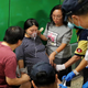 Workers comfort a pregnant woman as protesters disrupt subway service at Fortress Hill MTR station in Hong Kong, Aug. 5, 2019.